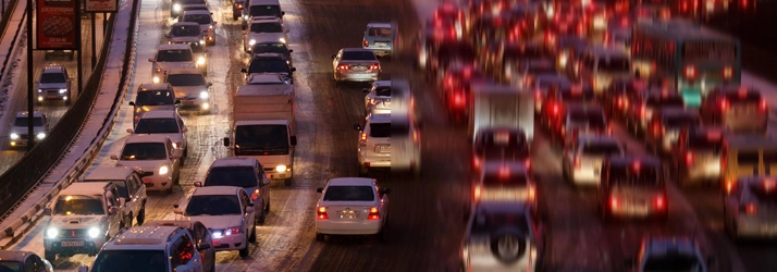 Cars on a road. Their lights are all blurred.