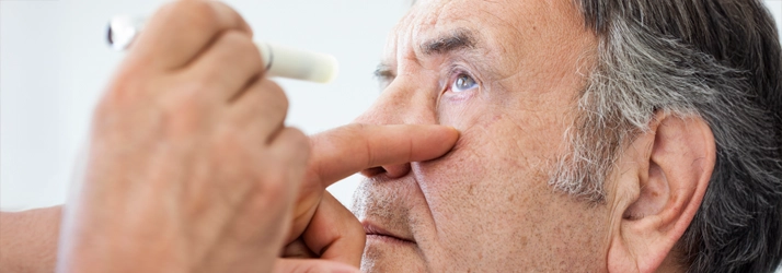 A man receiving a glaucoma test.